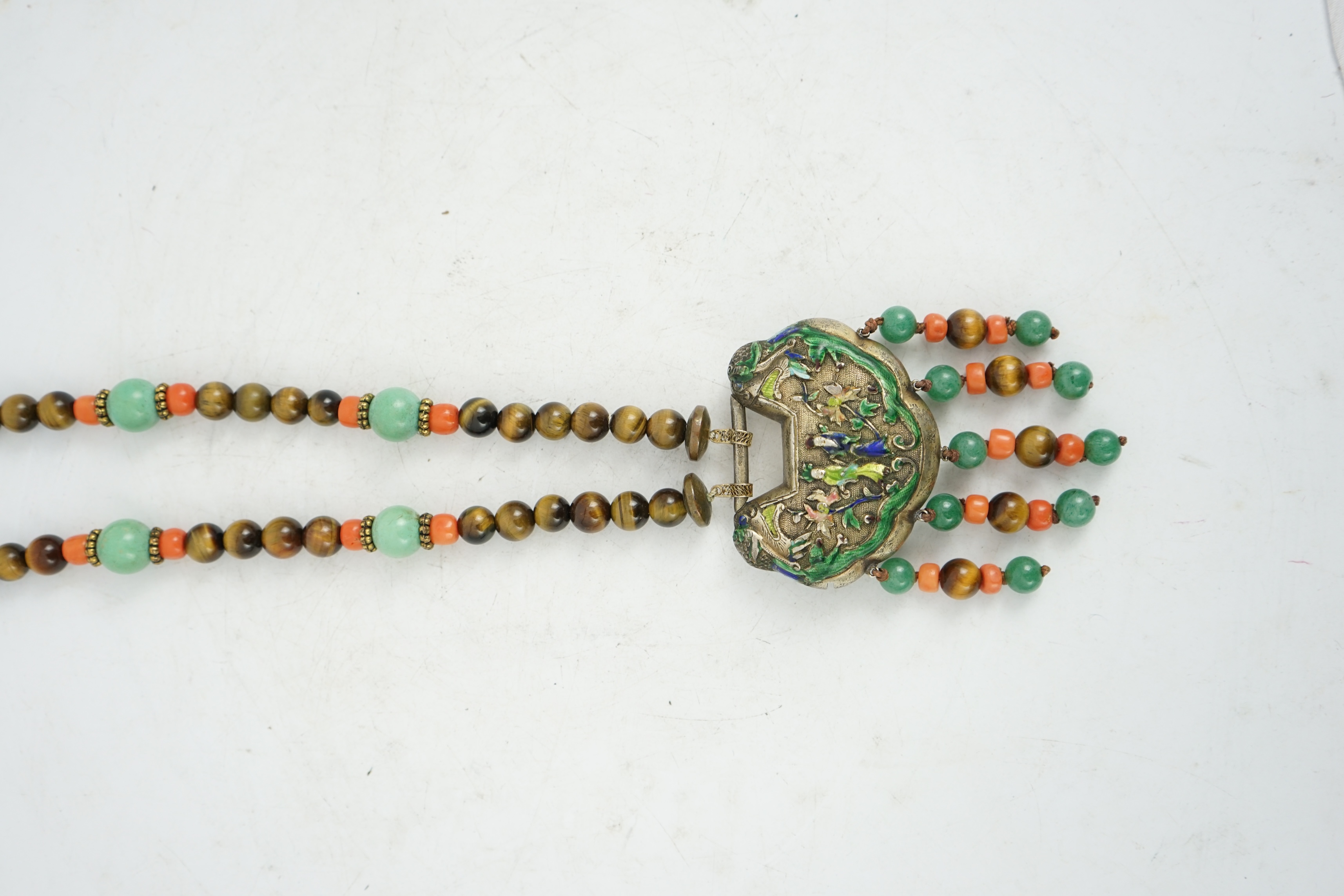 A Chinese silver and enamel amulet tiger's eye, coral and turquoise bead necklace, housed in a liberty box. Condition - good